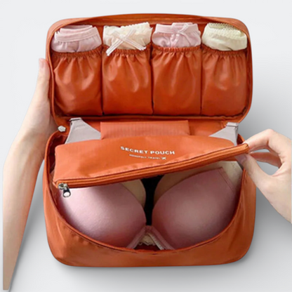 AïtaVia orange travel underwear organizer bag with multiple compartments for socks and bras.