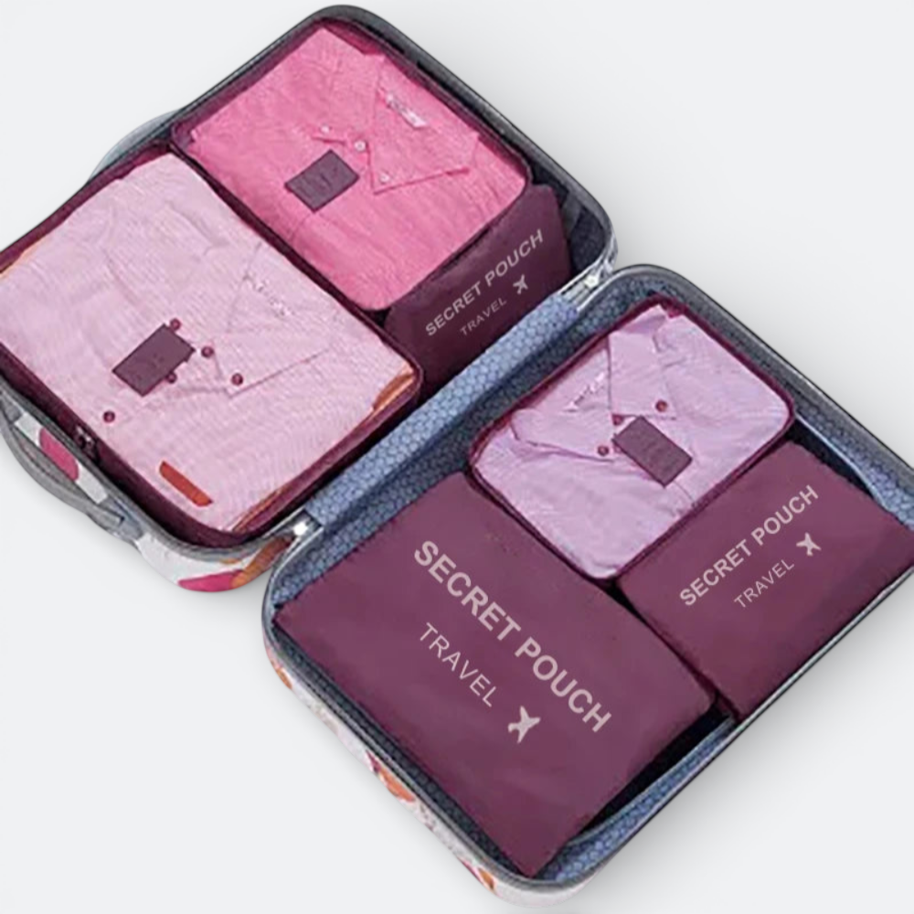 AïtaVia pink and purple packing cubes with shirts neatly folded inside, ideal for travel organization.