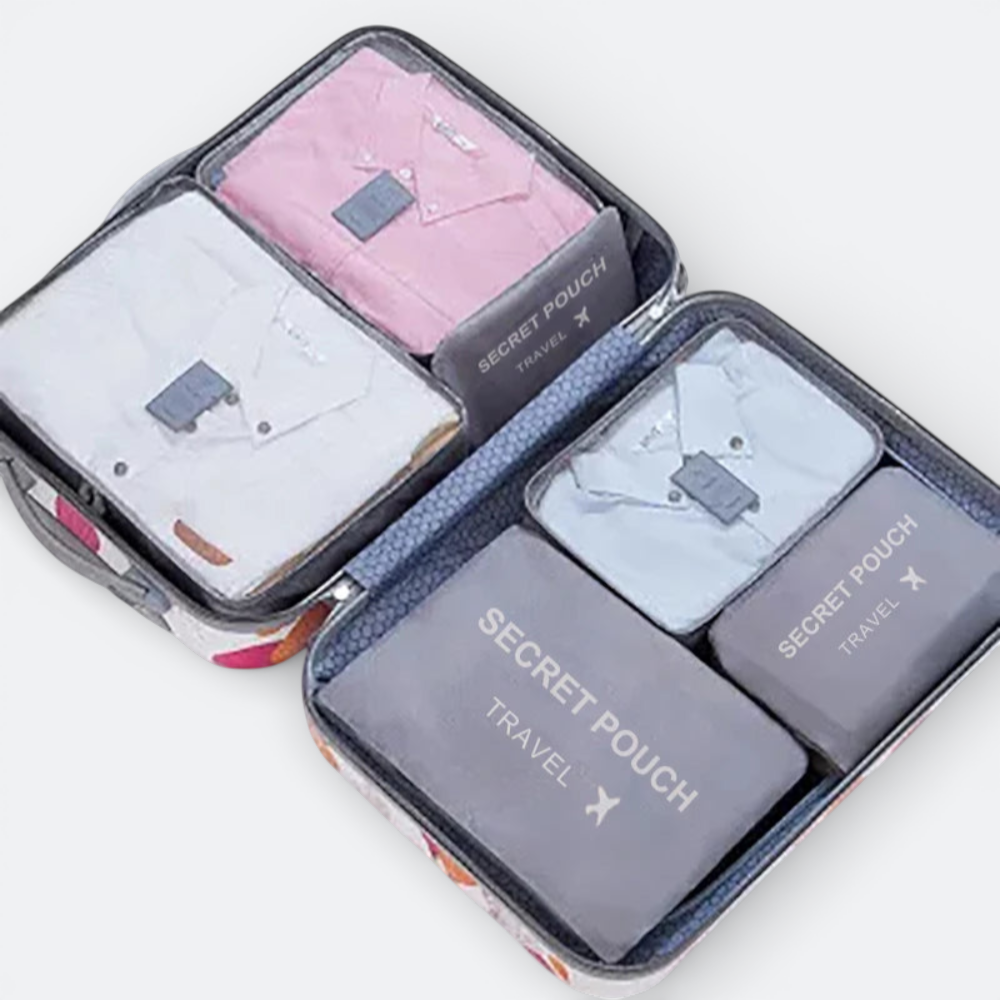 AïtaVia set of 4 grey packing cubes with shirts inside, including pink, white, and light blue. Ideal for travel organization.