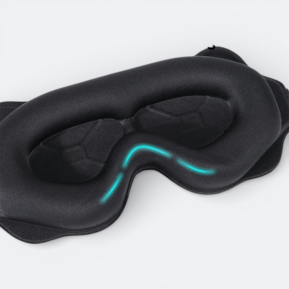 AïtaVia black padded sleep mask with contoured eye cups for total darkness and comfort during travel.