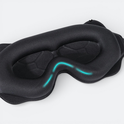 AïtaVia black padded sleep mask with contoured eye cups for total darkness and comfort during travel.