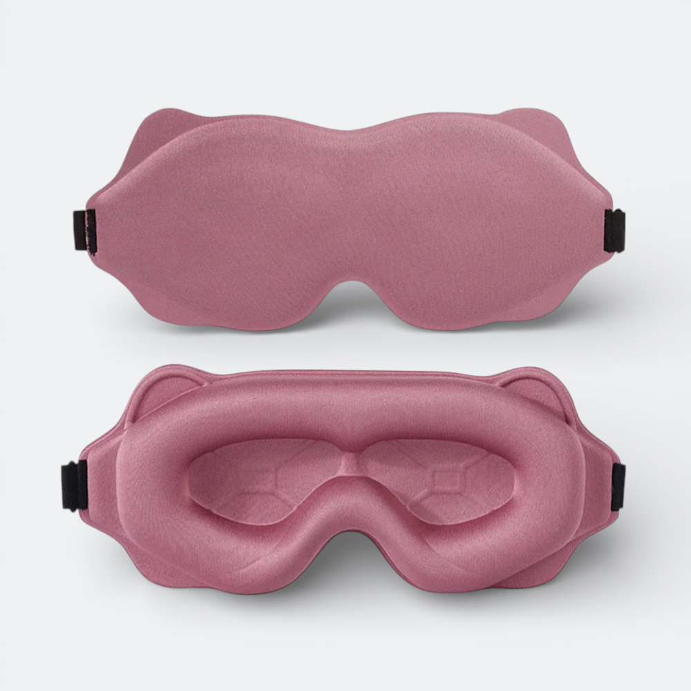 AïtaVia padded sleep mask in dusty rose, designed for travel comfort with contoured eye cups and adjustable strap.