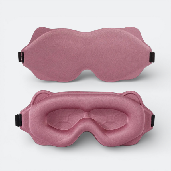 AïtaVia padded sleep mask in dusty rose, designed for travel comfort with contoured eye cups and adjustable strap.