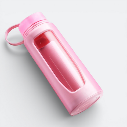 AïtaVia pink glass water bottle with a silicone sleeve and a loop handle. Ideal for travel and daily hydration.
