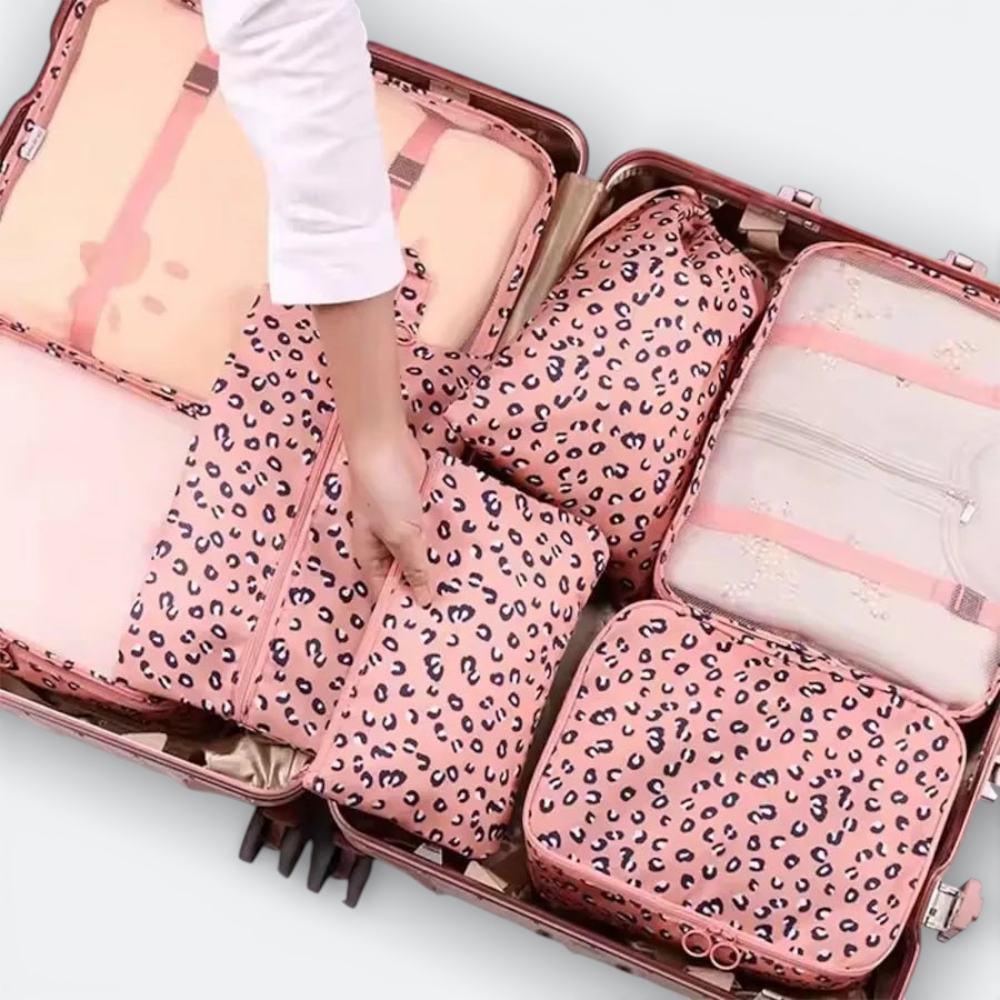 AïtaVia pink leopard print luggage organizer set with mesh panels and zippers, neatly packed in a suitcase.