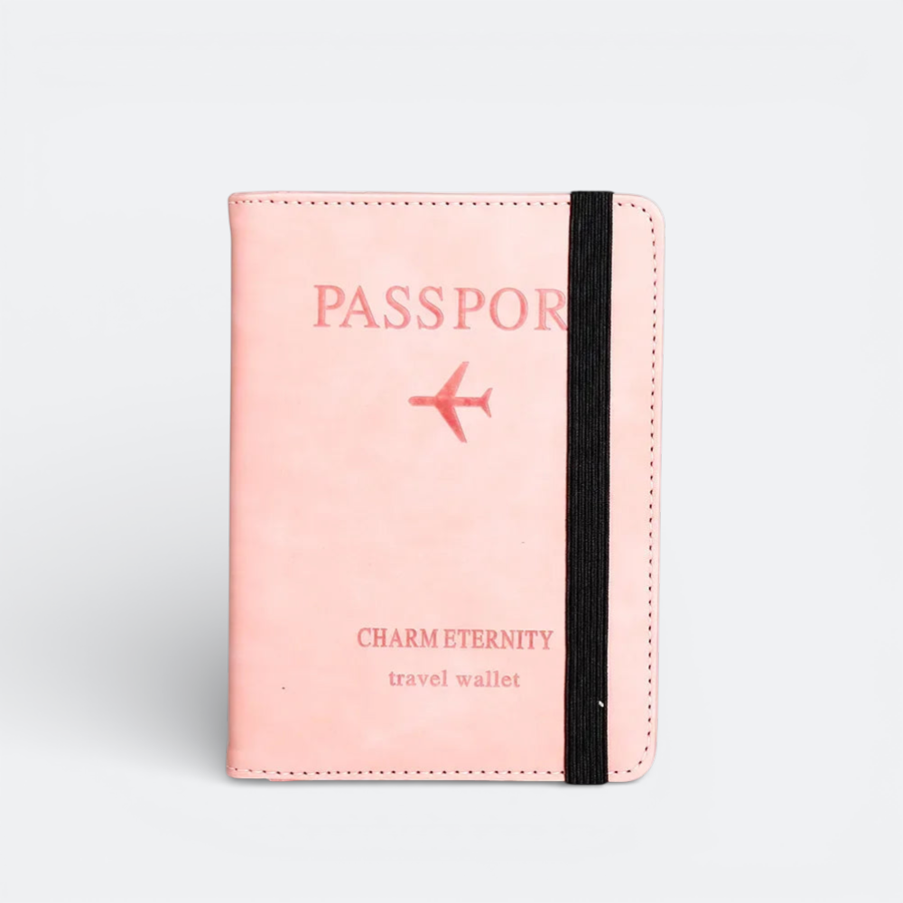 AïtaVia pink passport holder with an airplane graphic and elastic closure. Features "PASSPORT" and "travel wallet" text.