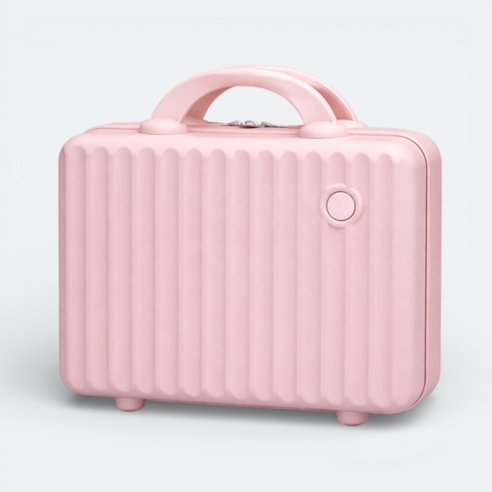 AïtaVia pink ribbed hard-shell makeup vanity case with a top handle and four small feet.