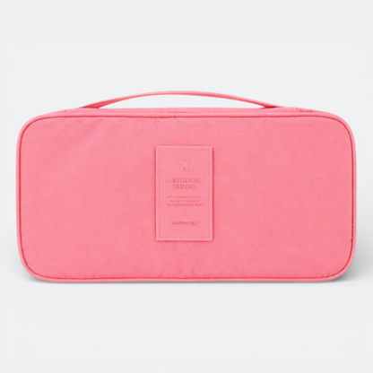 AïtaVia pink travel underwear organizer bag with handle and a stitched patch that says "ORIGINAL SERIES" and "WANWAYO"