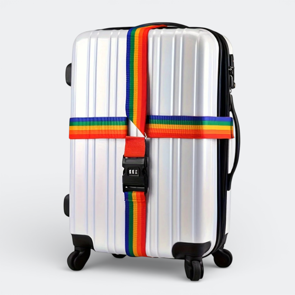 AïtaVia rainbow luggage strap with combination lock securing a silver suitcase. Durable polyester strap for travel security.