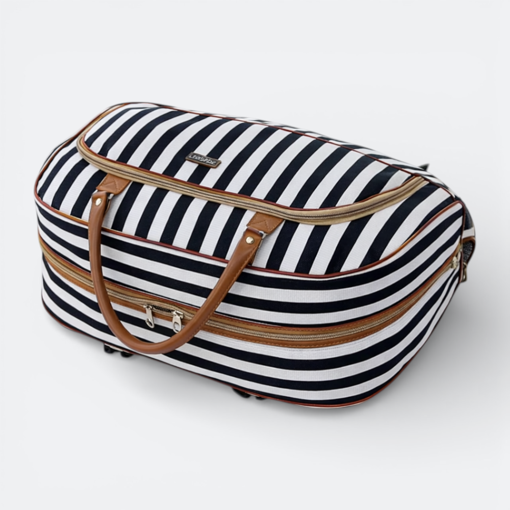 AïtaVia black and white striped rolling travel duffel bag with brown leather handles and telescopic handle.