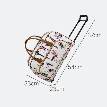 AïtaVia white travel duffel bag with a repeating pattern of women in fashion outfits and colorful dots. Features brown leather handles and trim, and a retractable handle with wheels.
