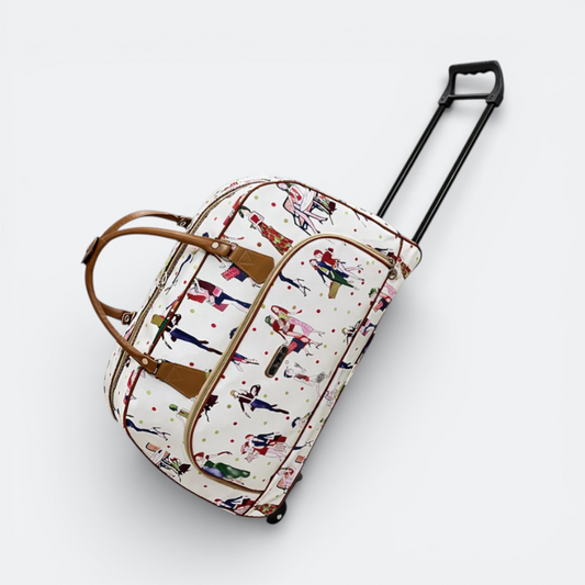 AïtaVia white travel duffel bag with a colourful fashion illustration print and brown leather accents. Features wheels and a retractable handle.