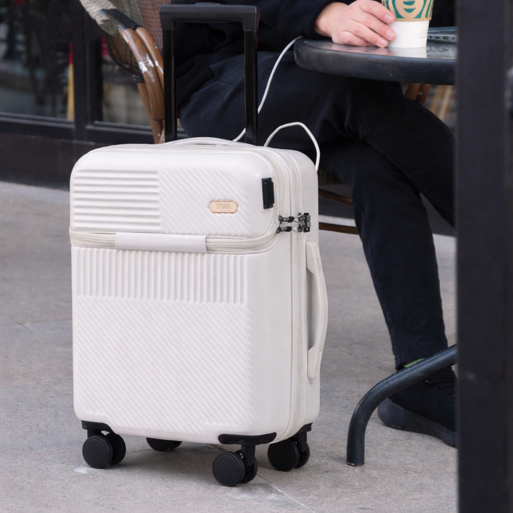 AïtaVia white front-opening suitcase with textured finish and spinner wheels, perfect for travel.