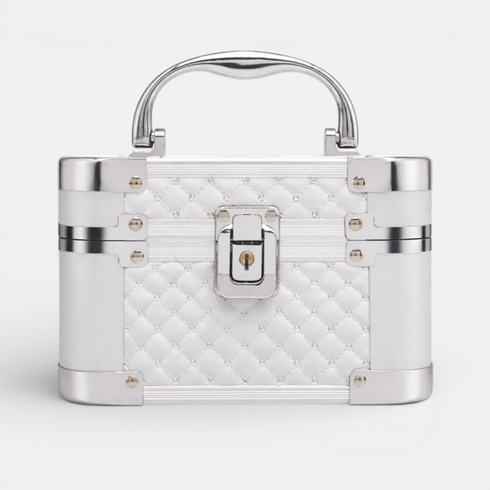 AïtaVia white quilted cosmetic travel jewelry box with silver trim and handle, featuring a lock closure.