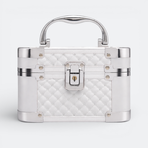 AïtaVia white quilted cosmetic travel jewelry box with silver trim and handle, featuring a lock closure.