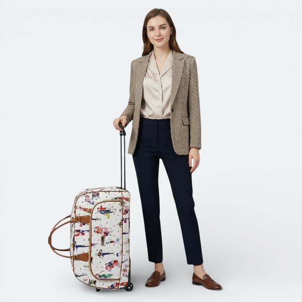 AïtaVia women's carry-on suitcase with a playful print and leather trim, featuring a retractable handle and wheels.