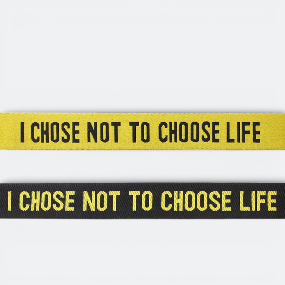 AïtaVia yellow and black luggage straps with "I CHOSE NOT TO CHOOSE LIFE" text.