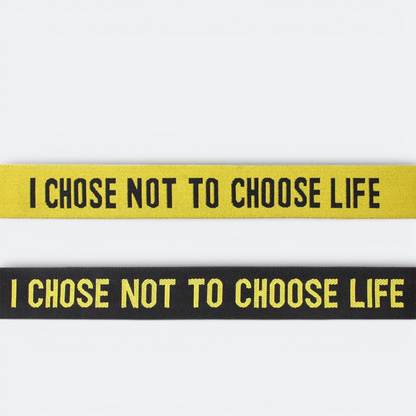 AïtaVia yellow and black luggage straps with "I CHOSE NOT TO CHOOSE LIFE" text.